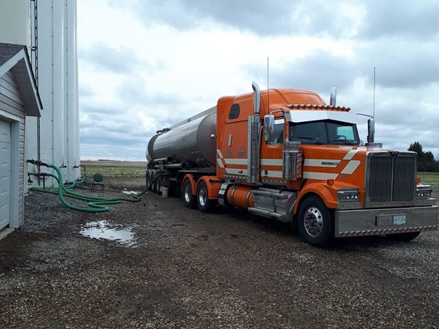 CK Transportation liquid hauling orange tractor unit
